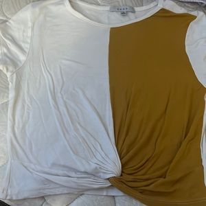 white and mustard yellow crossed at the bottom crop top